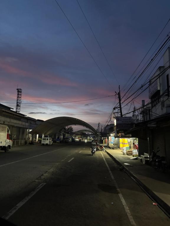 a road with a bridge in the middle of a city at Tangub hotel in Polao