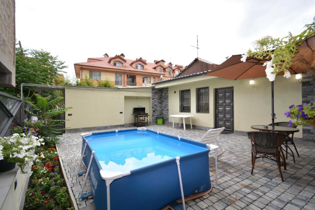 a pool in the backyard of a house at Kaskade House in Yerevan