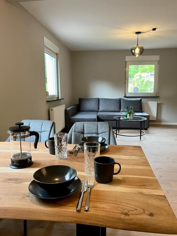 a living room with a table and a couch at Ferienhaus Kropsbach in Sankt Martin