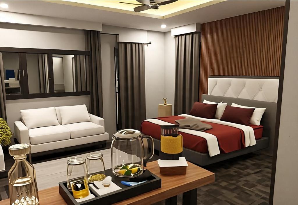 a bedroom with a bed and a living room at Samal Hillside Inn in Samal