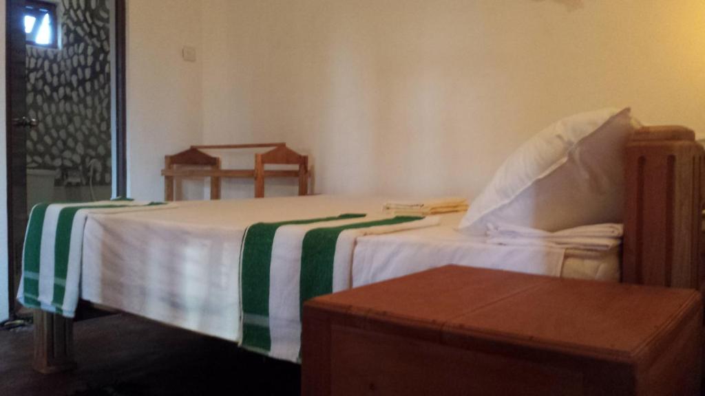 Postel nebo postele na pokoji v ubytování Yaye Guest House