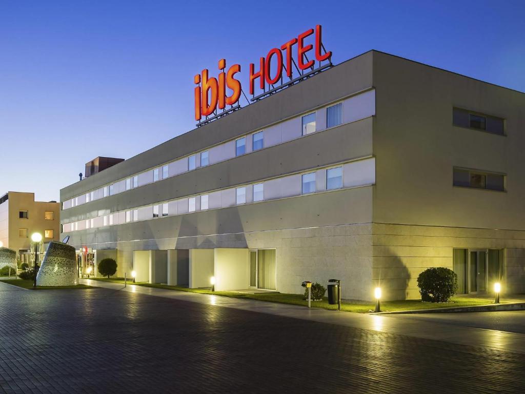 a building with a sign on top of it at Hotel ibis Porto Sao Joao in Porto