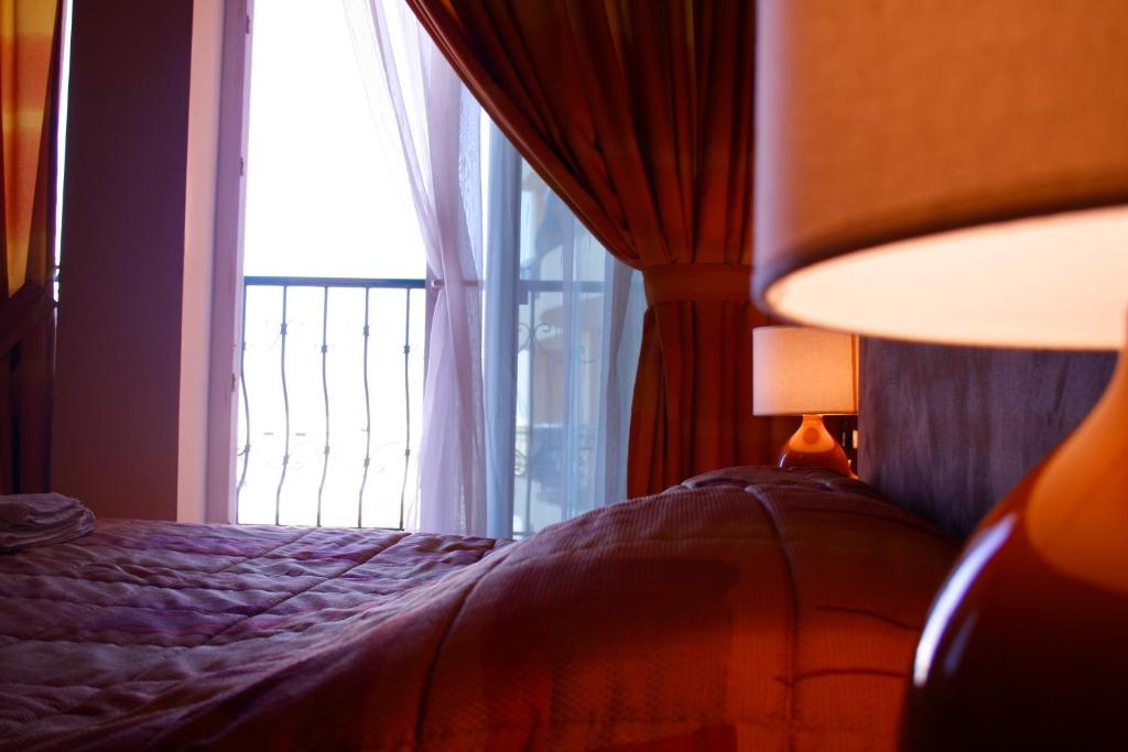 Postel nebo postele na pokoji v ubytování Mariam Hotel