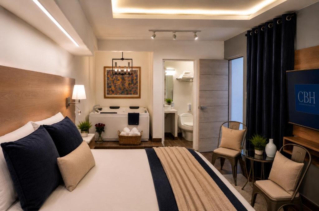 a hotel room with a bed and a bathroom at Casa Bella Boutique Hotel in Antigua Guatemala