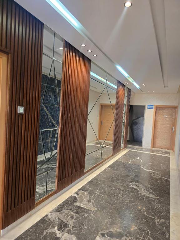 a hallway with sliding glass doors in a building at عروس النخيل in Tétouan