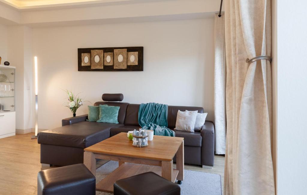 a living room with a couch and a table at Diamond in Binz
