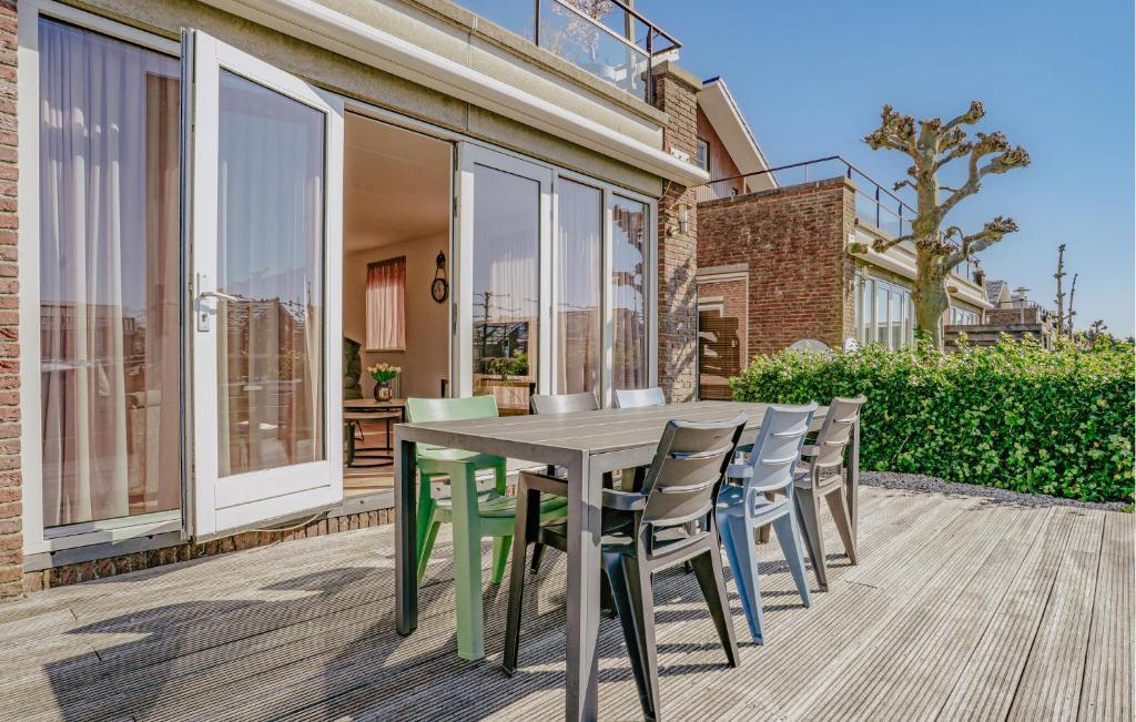 a wooden table and chairs on a patio at Bob Ross in Naarden