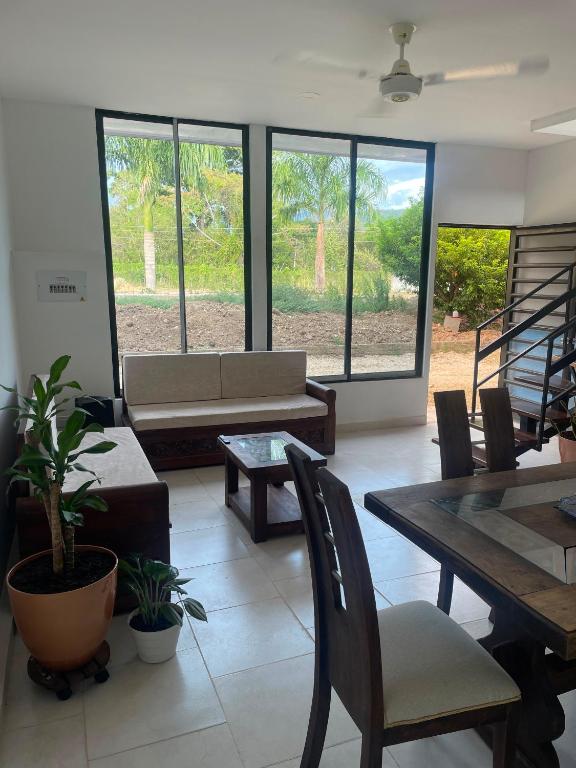 a living room with a couch and a table at Casa Sol & Descanso Tocaima in Tocaima
