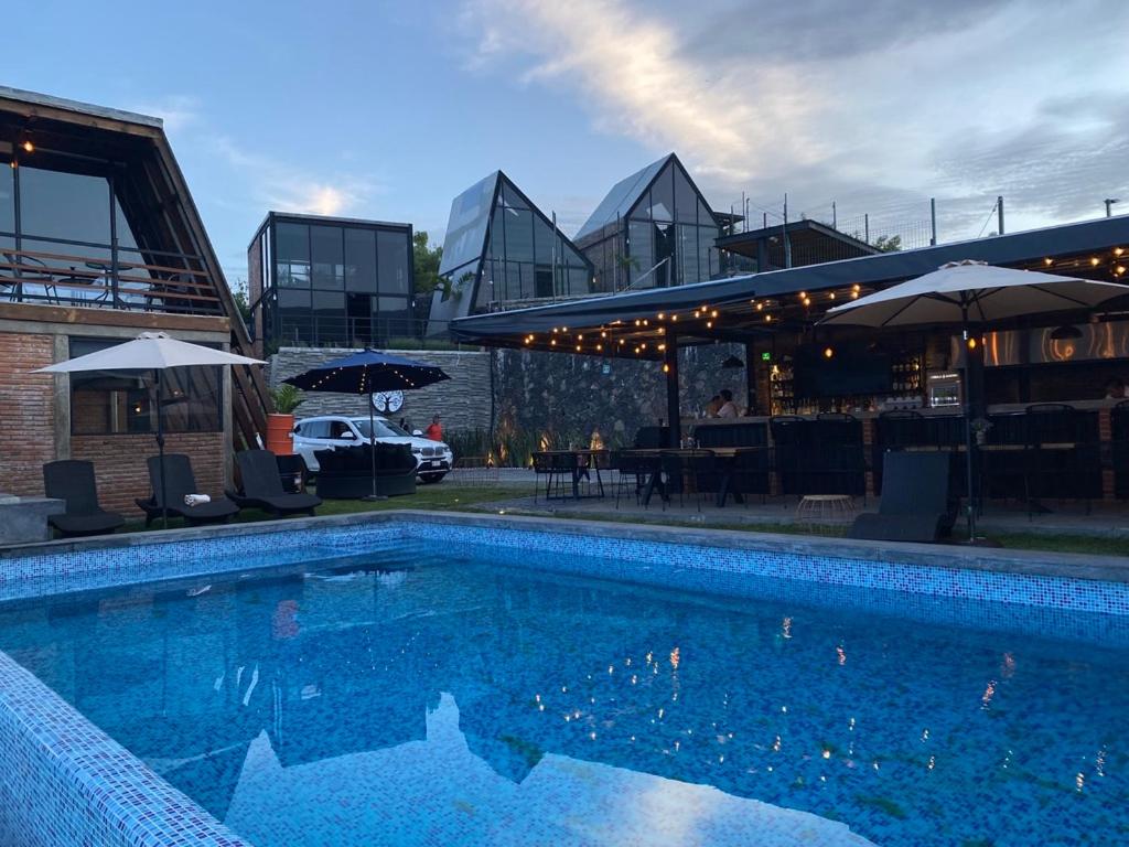 a large swimming pool in front of a building at Macpalo in Amatlán