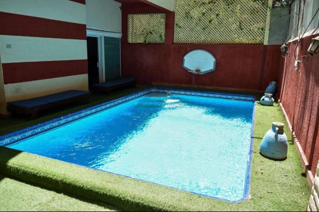 a large swimming pool in a building with at Bianki vip villa in Alexandria
