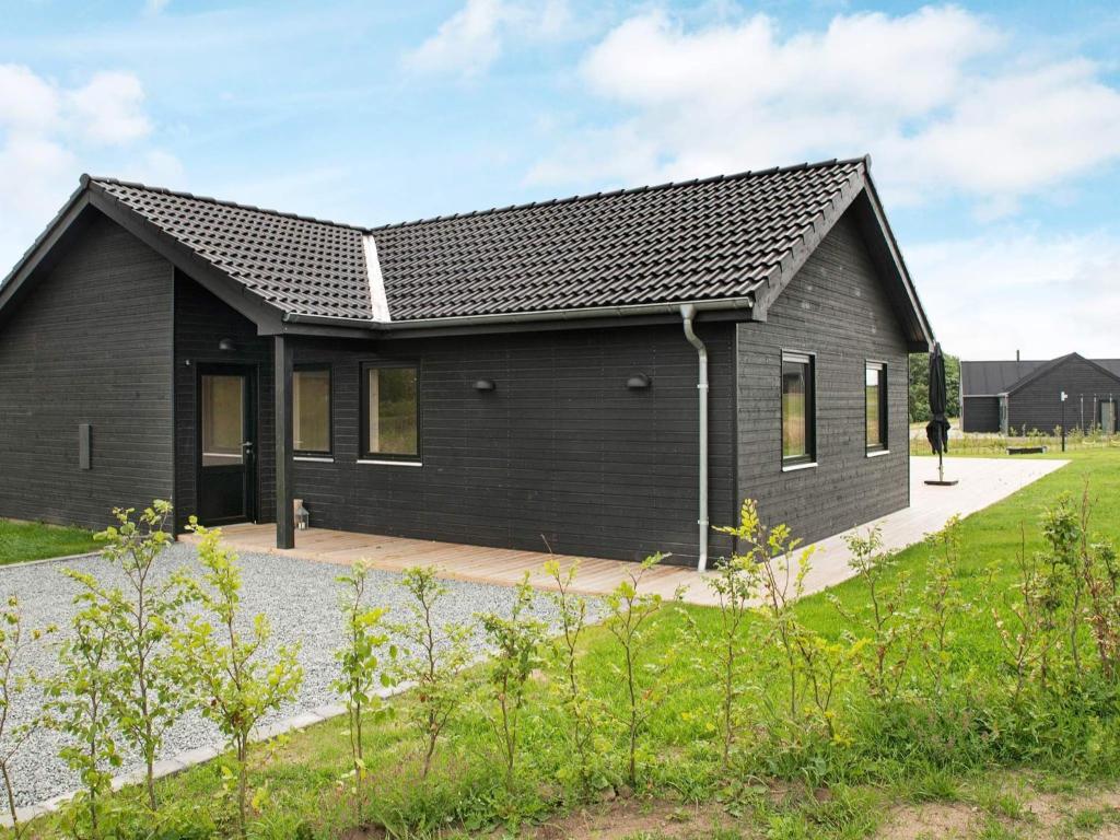 a black house with a black roof at 5 star holiday home in Haderslev in Haderslev
