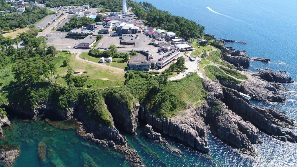 an aerial view of a small island in the ocean at 東尋坊近く自転車無料 コンビニ目の前1ルーム貸切 in Mikuni