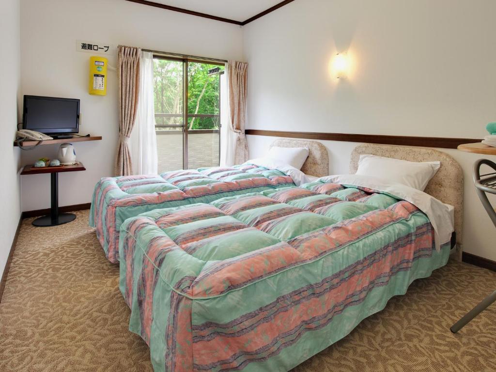 Postel nebo postele na pokoji v ubytování Chateau Le Fleur