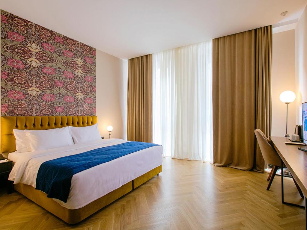 Postel nebo postele na pokoji v ubytování Museum Hotel