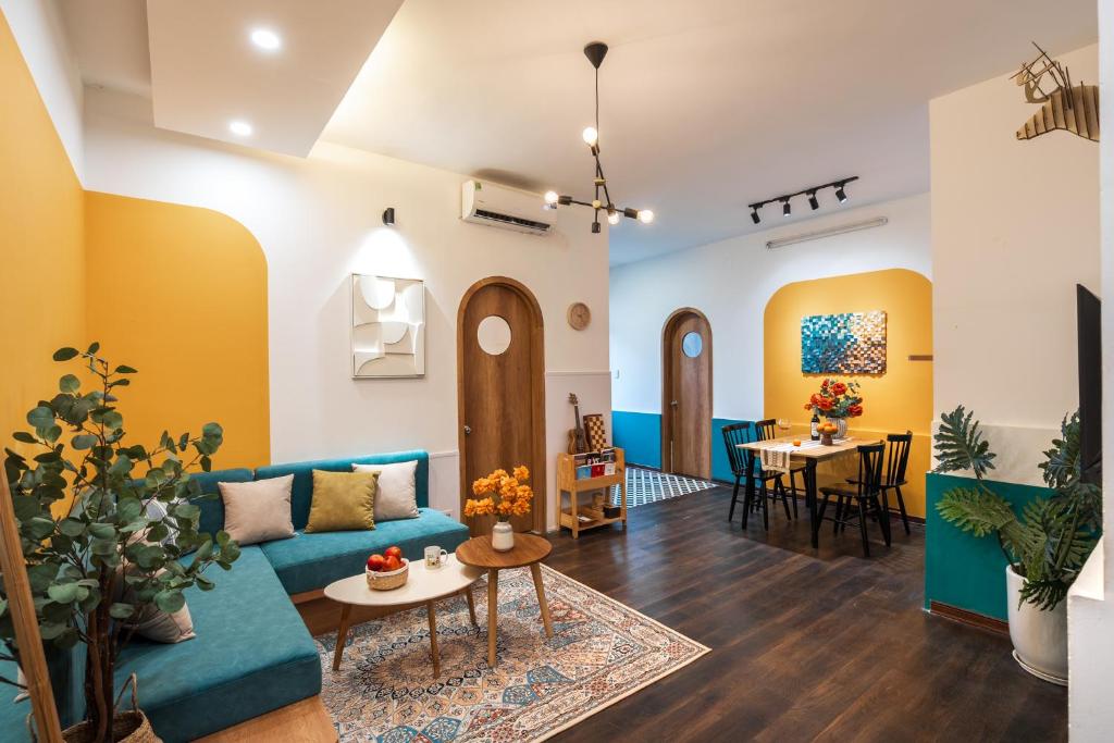 a living room with a couch and a table at Spacious Hoan Kiem Apartment in Hanoi