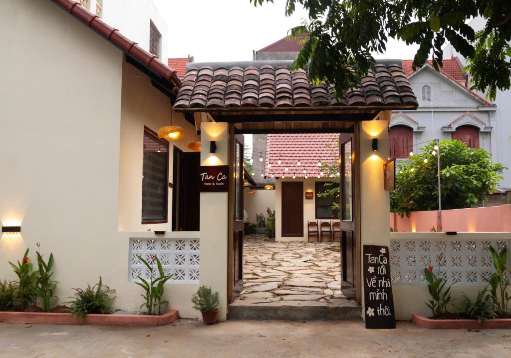 an entrance to a house with a stone walkway at Tan Ca Home & Studio Ninh Bình in Kỳ Vĩ