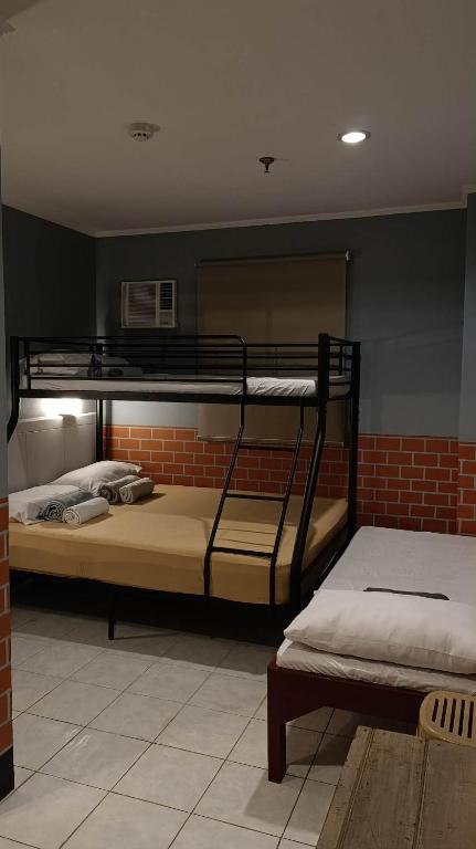 two bunk beds are in a room with at Ciello Accomodation in Cagayan de Oro