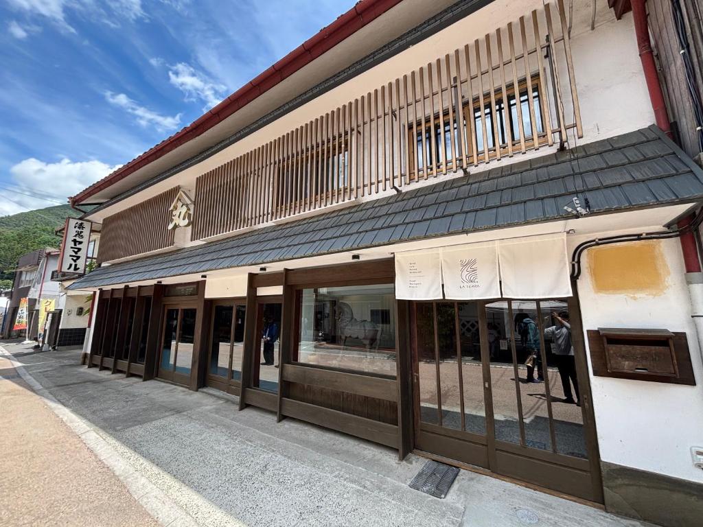 a store front of a building on a street at La Terra Hirasawa in Shiojiri