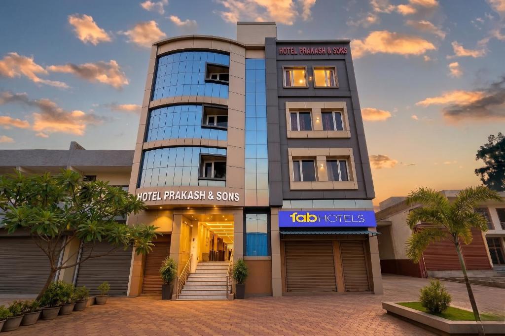 a building with a sign in front of it at FabHotel Prakash & Sons, Hoshangabad Rd in Somarda Kauasot