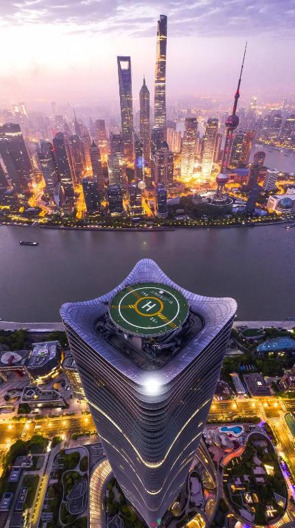 a view of a large city at night at Pu Yu Apartment in Shanghai