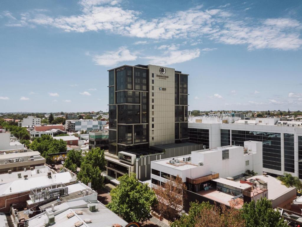 an aerial view of a tall building in a city at Doubletree By Hilton Perth Northbridge in Perth