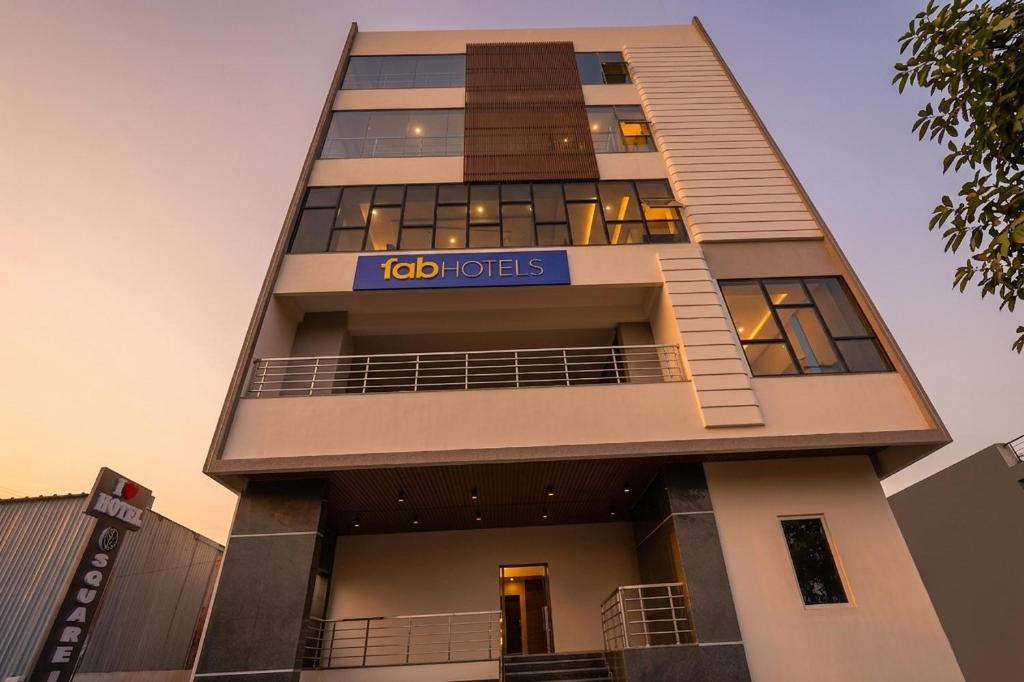 a tall building with a sign on it at FabHotel A Square - 400m from Bhimavaram Junction in Bhīmavaram