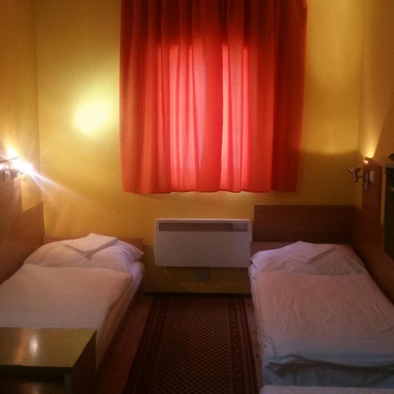 Postel nebo postele na pokoji v ubytování Kis-Duna Motel & Camping