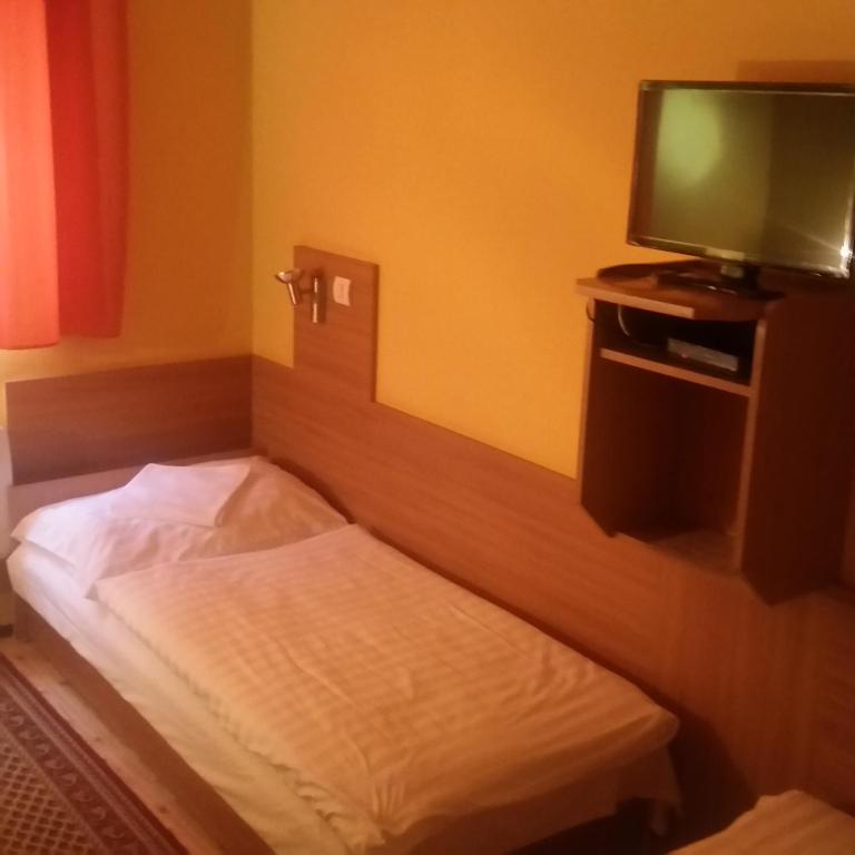 Postel nebo postele na pokoji v ubytování Kis-Duna Motel & Camping