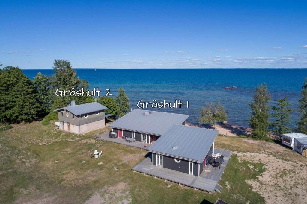 an aerial view of a house and the ocean at VGO1064-Karlsborg-Silverdalen-1 in Karlsborg