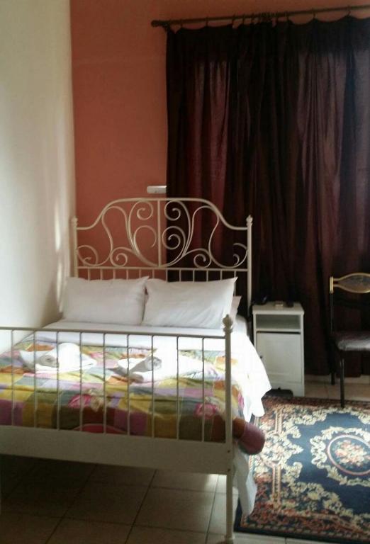 Postel nebo postele na pokoji v ubytování Hotel Korydallos
