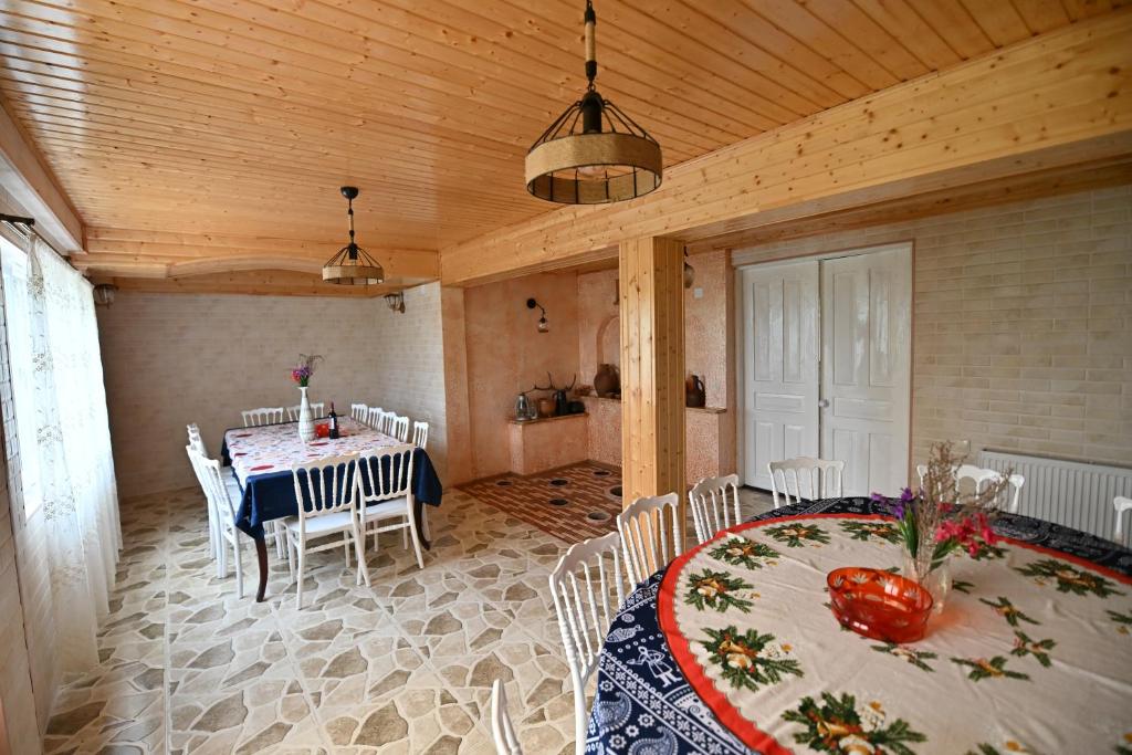 a dining room with a table and chairs at Hilltop Jikha in Jikhaskari