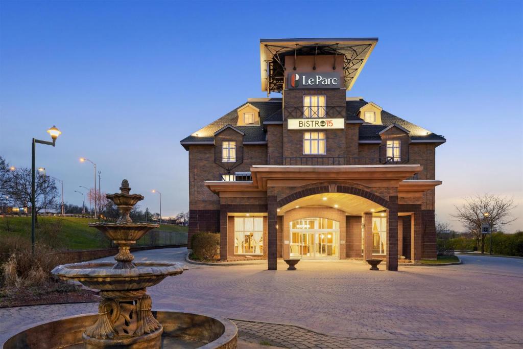 a building with a fountain in front of it at Le Parc Gatineau, Tapestry Collection by Hilton in Gatineau
