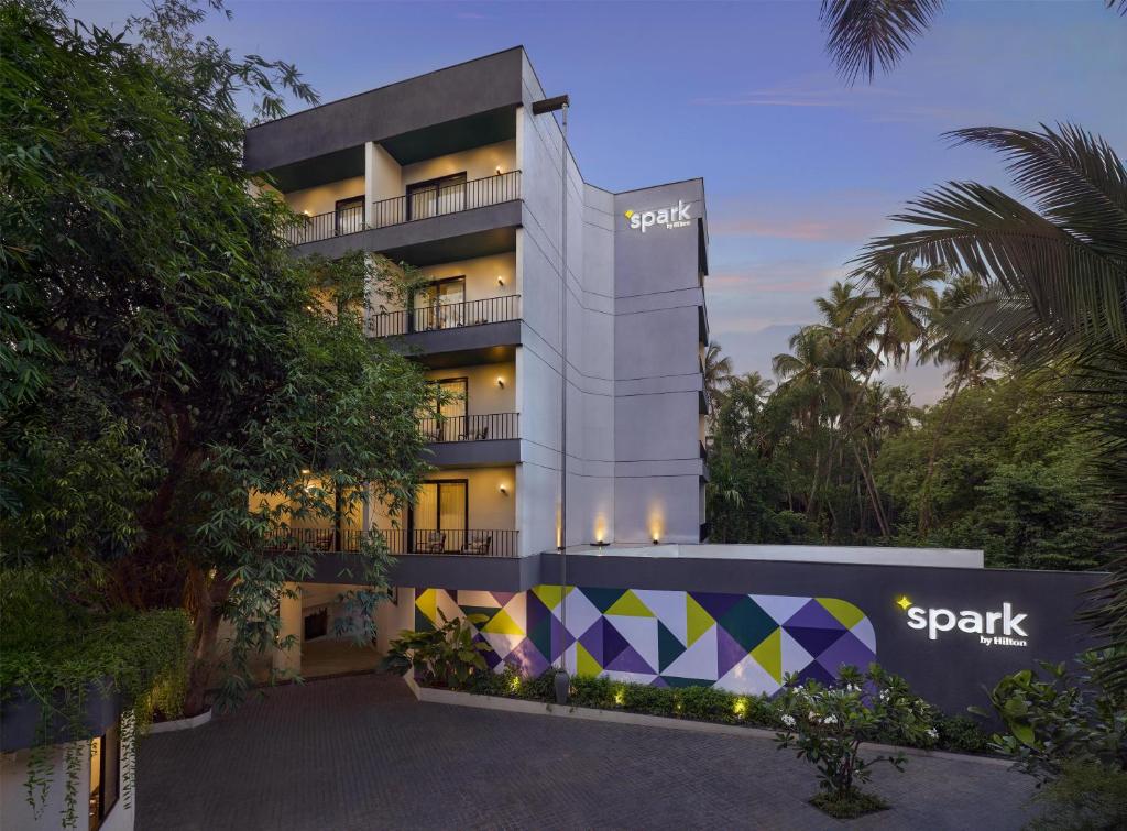 a building with a spark sign in front of it at Spark By Hilton Goa Calangute in Goa