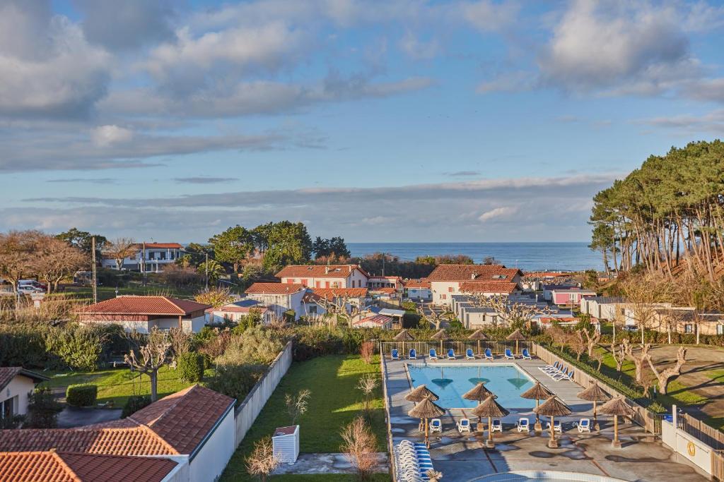 an aerial view of a resort with a swimming pool at Résidence Odalys Erromardie Plage in Saint-Jean-de-Luz
