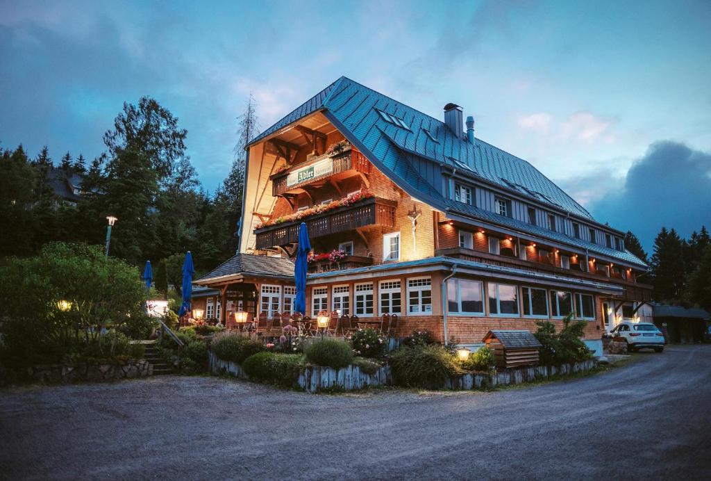 a large building with a gambrel roof at Hotel Adler Bärental in Feldberg