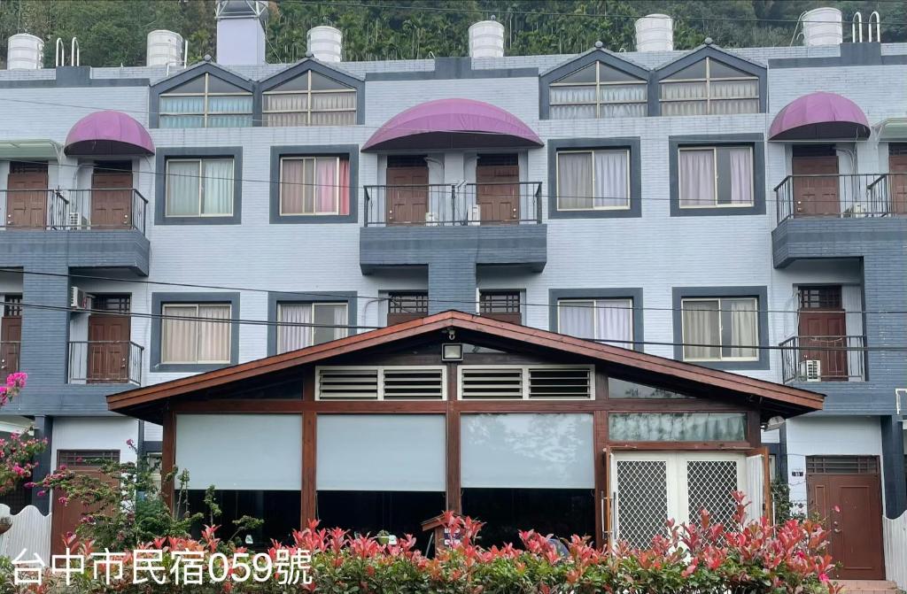 a large building with balconies on the side of it at 168 Living Water in Dongshi