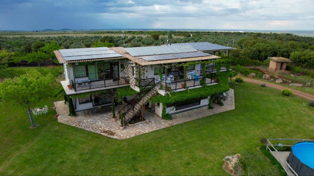 an aerial view of a house with a spiral at Finca Los Pájaros Naturaleza cerca de Puy du Fou in Navahermosa