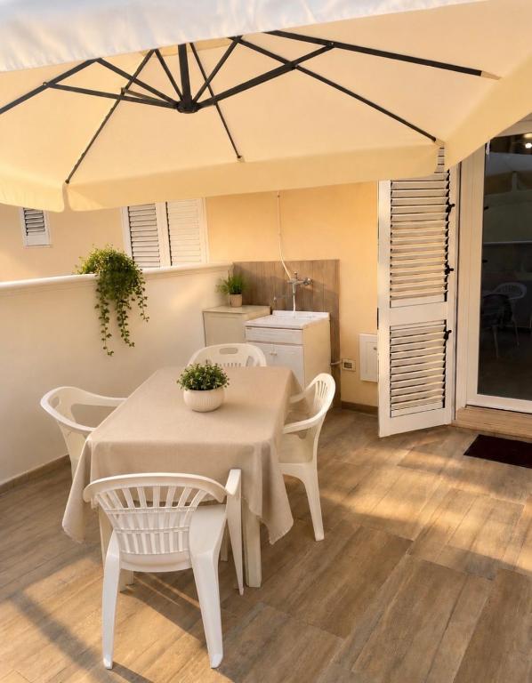 a dining room with a table and chairs under a tent at Supera Home in Gallipoli