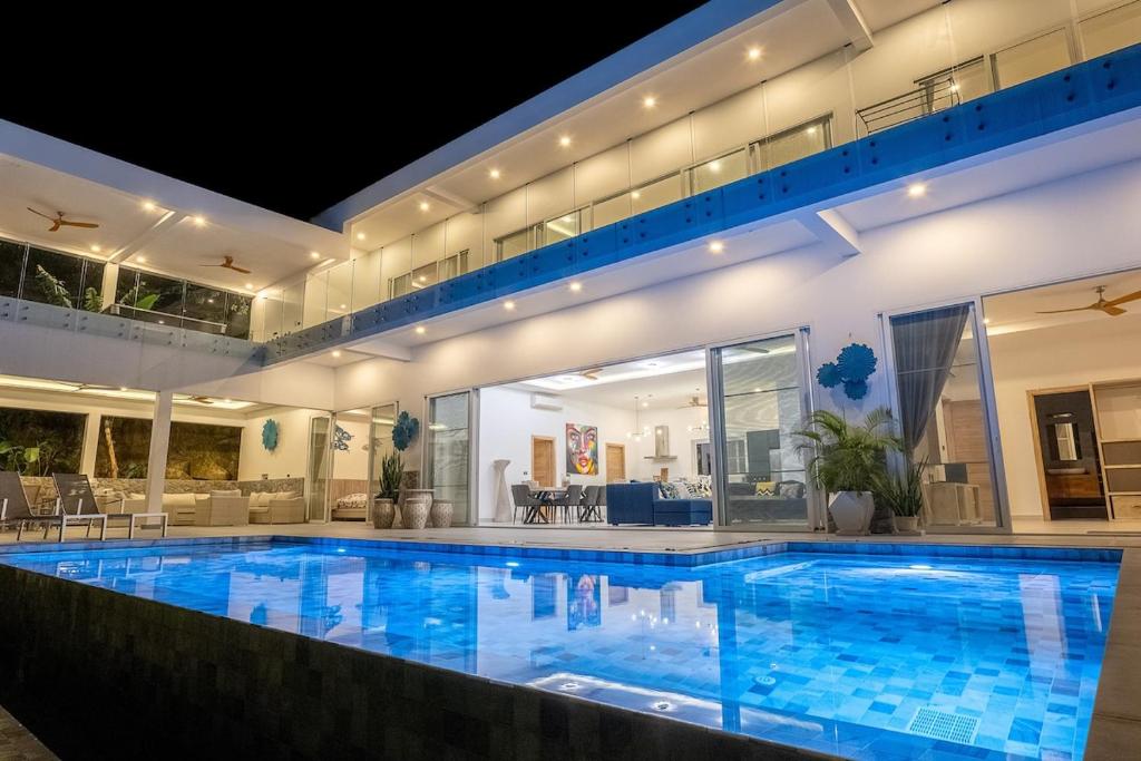 a large swimming pool in a large house at The Palm Oasis in Lamai
