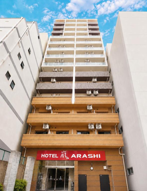a tall building with a hotel in front of it at Hotel Arashi Nippombashi 1 No006 in Osaka