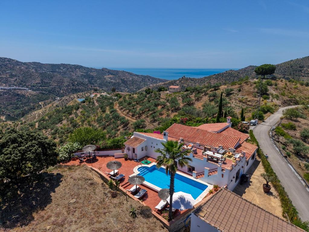an aerial view of a house with a swimming pool at Casa Azafranes - Boutique B&B - Arenas in Arenas
