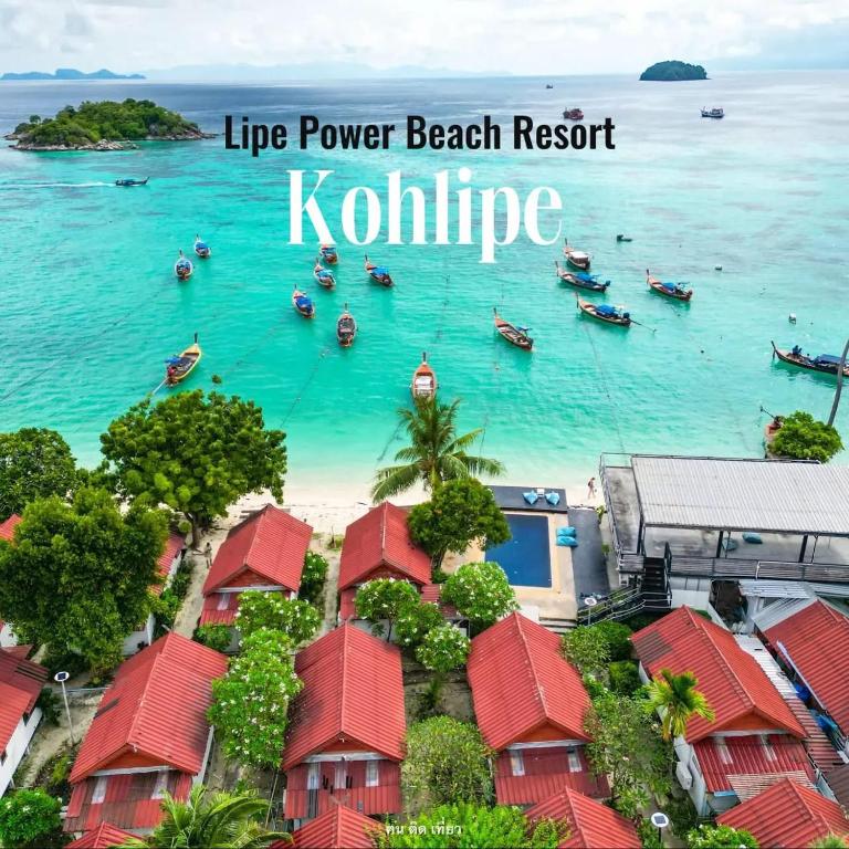 a view of a beach with boats in the water at Lipe Power Beach Resort in Ko Lipe