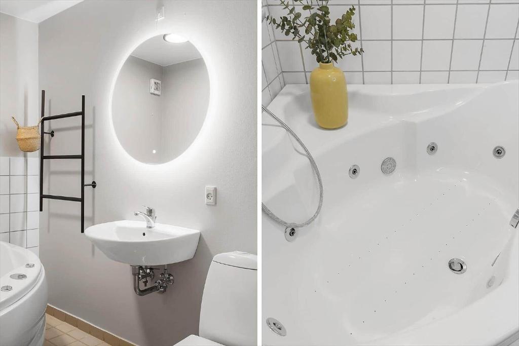 a bathroom with a sink and a toilet and a mirror at 7726-Hvide-Sande-Slusen-26 in Hvide Sande