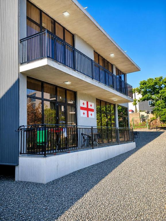 a building with a red cross on the side of it at LIFE GUARD ქობულეთი in Kobuleti