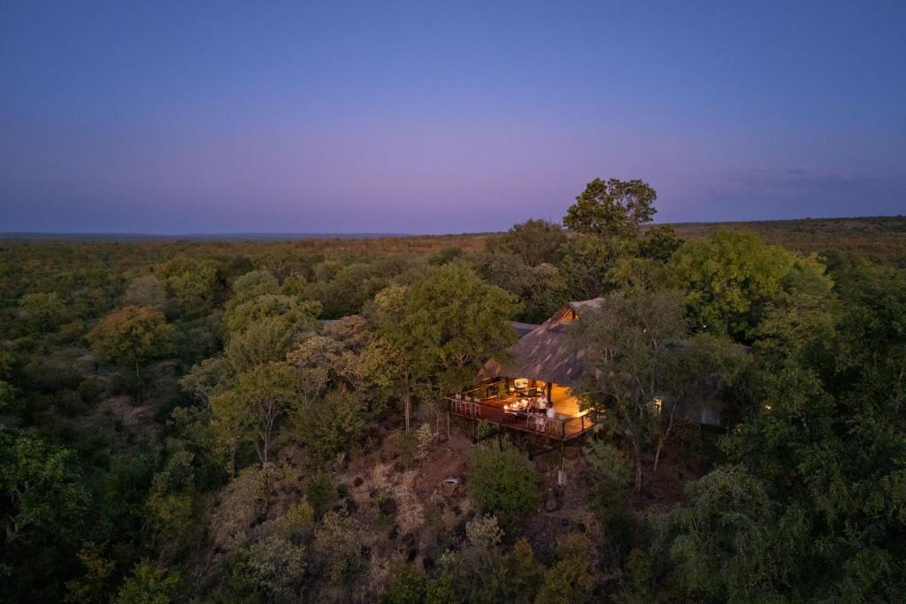 an overhead view of a house in the woods at Masuwe Lodge in Victoria Falls