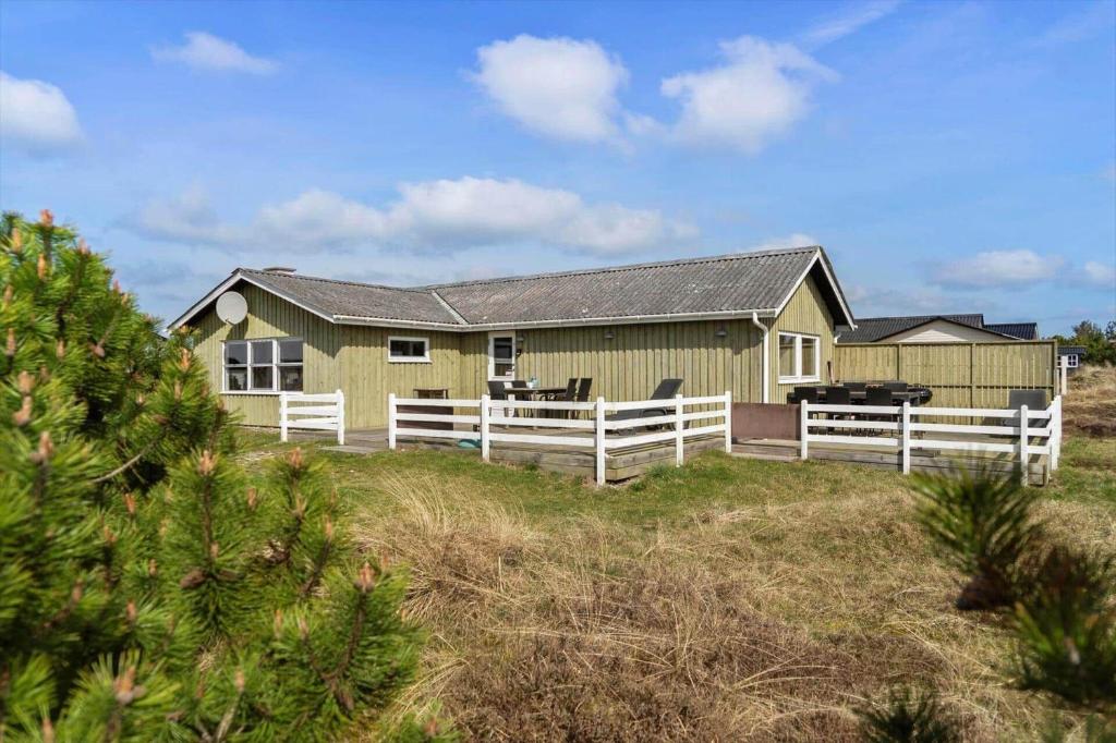 a house with a white fence in front of it at 1319-Thisted-Store-Knuds-Vej-9 in Thisted