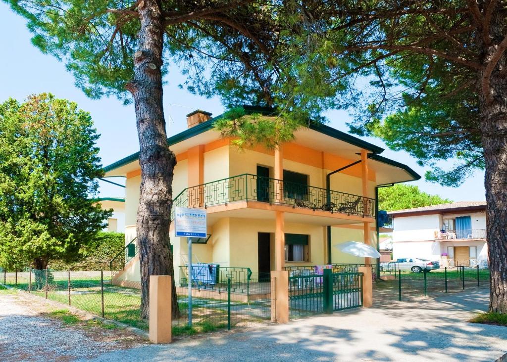 a building with trees in front of it at Luca in Bibione