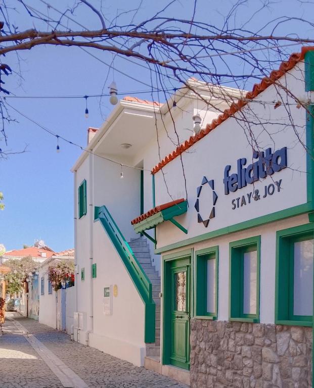 a building with a soccer ball sign on it at Felicitta Stay & Joy in Seferihisar