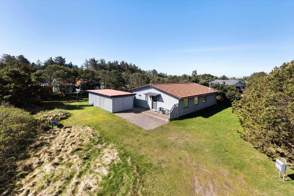 an aerial view of a house on a grassy hill at 1352-Vestervig-Isfuglevej-19 in Vestervig