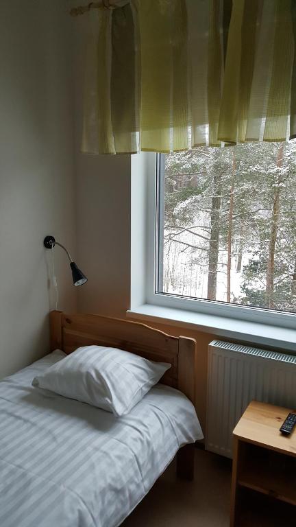Postel nebo postele na pokoji v ubytování Männiku JK
